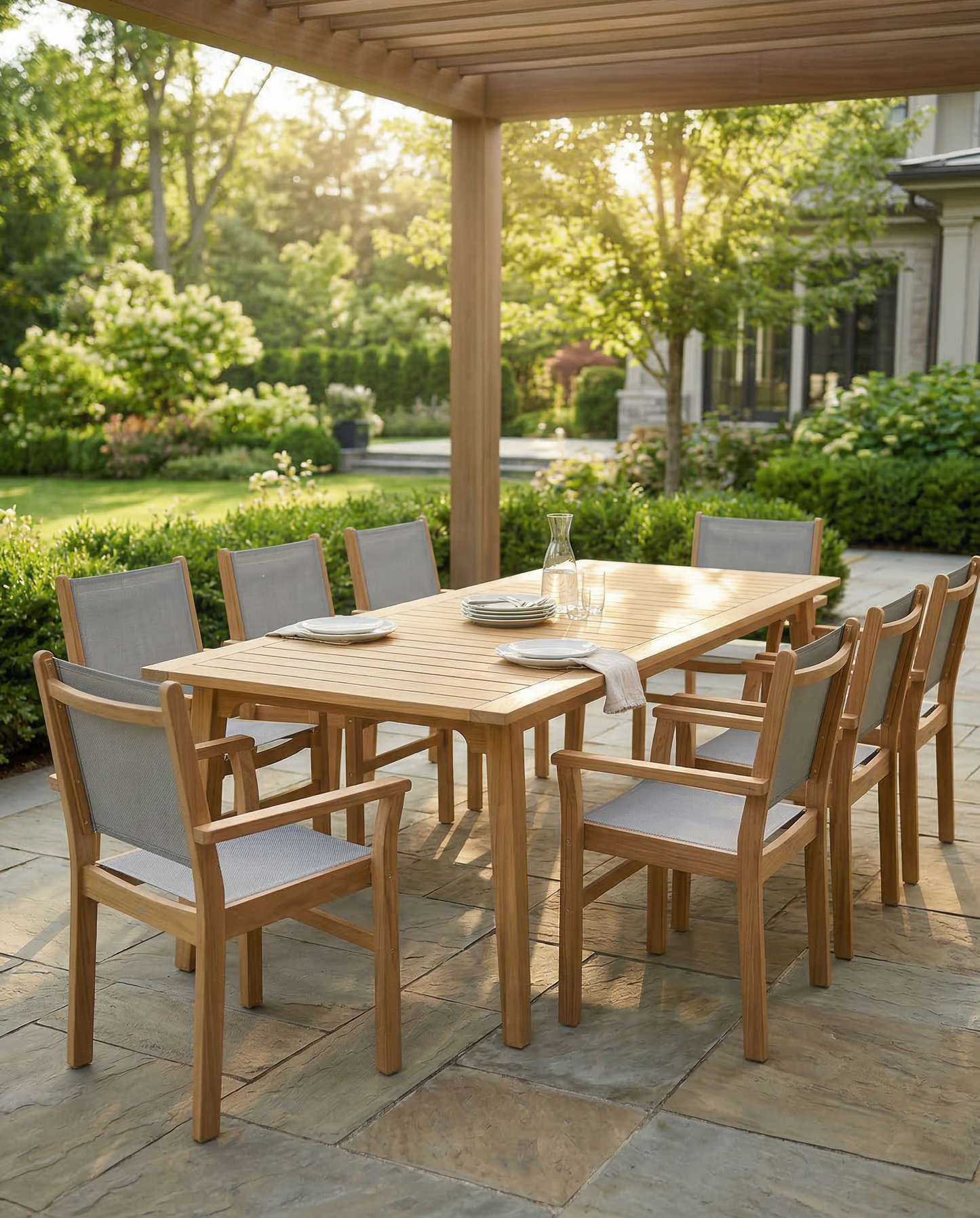 Wooden outdoor dining table with chairs on a patio