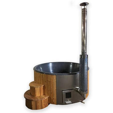 Wood-fired hot tub with stainless steel wood-burning heater and a polished stainless steel chimney, surrounded by Thermo-Spruce wood and steps, with a dark grey contoured fiberglass lining.