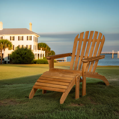 Wooden Adirondack chair on a grassy lawn with a house and water in the background