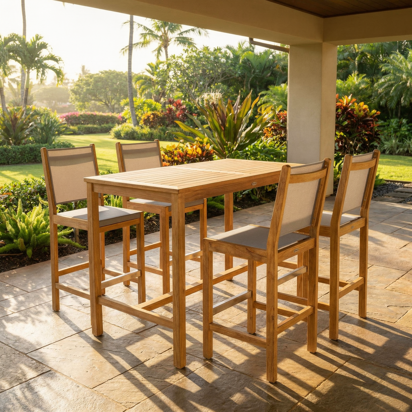 Outdoor patio set with wooden table and chairs on a stone patio with garden view