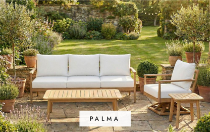 Outdoor furniture set with white cushions and wooden tables in a garden setting, featuring the Palma Collection