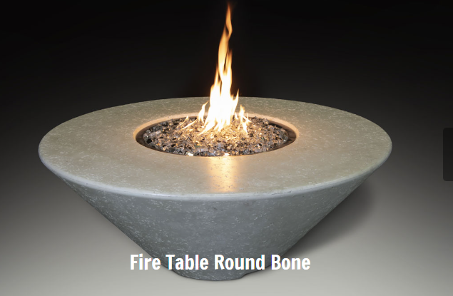 Concrete fire table with flames on a dark background