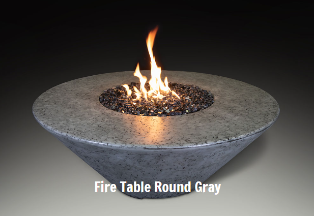 Round gray fire table with flames on a dark background