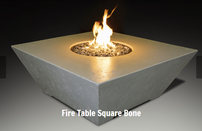Concrete fire table with flames on a dark background